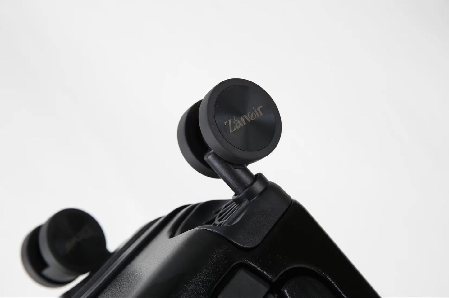 Close-up of panther black carry-on suitcase wheel with brand logo