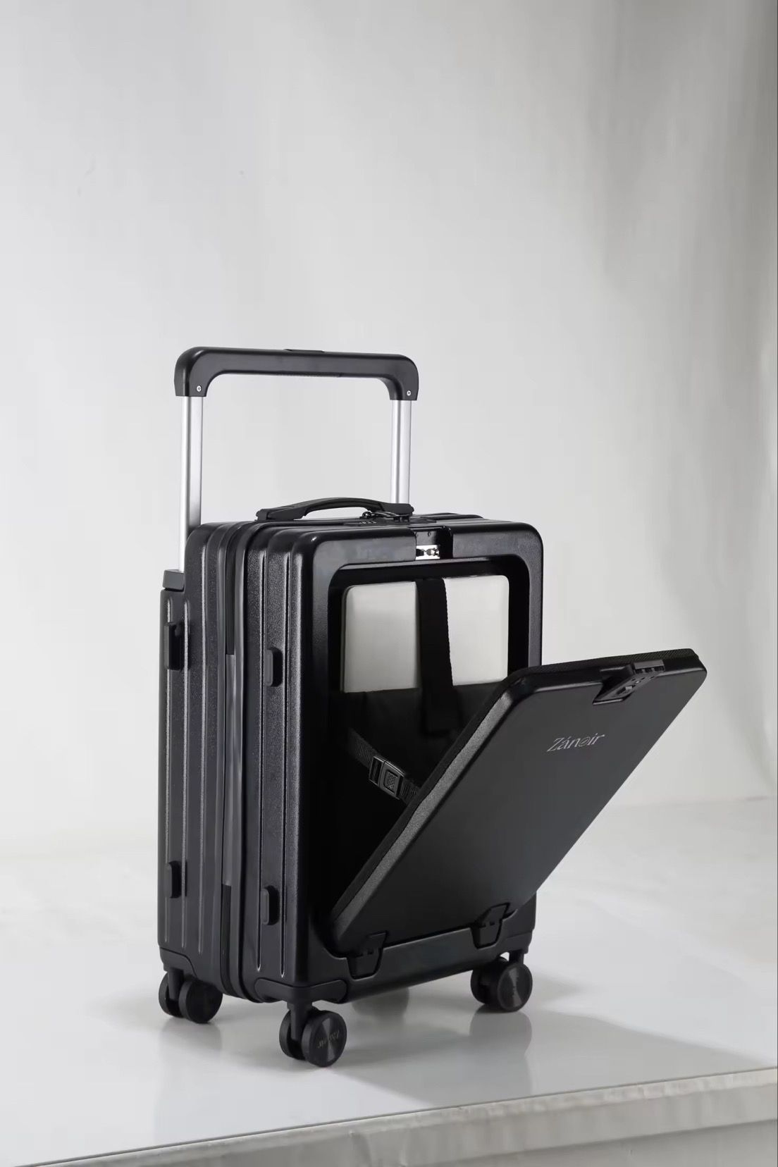 Black travel suitcase with laptop compartment