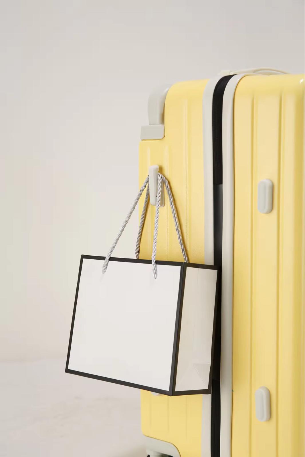 Yellow travel suitcase with side hook