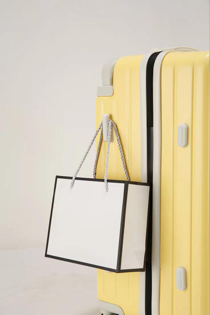 Yellow travel suitcase with side hook