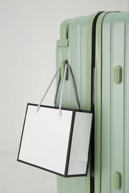 Green travel suitcase with side hook