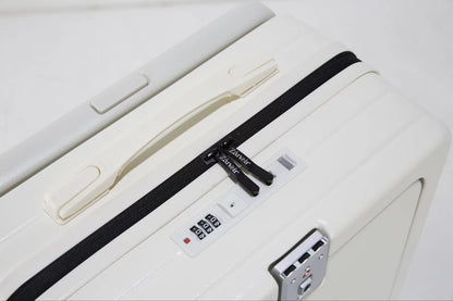 Close-up of polar white suitcase zipper with brand logo