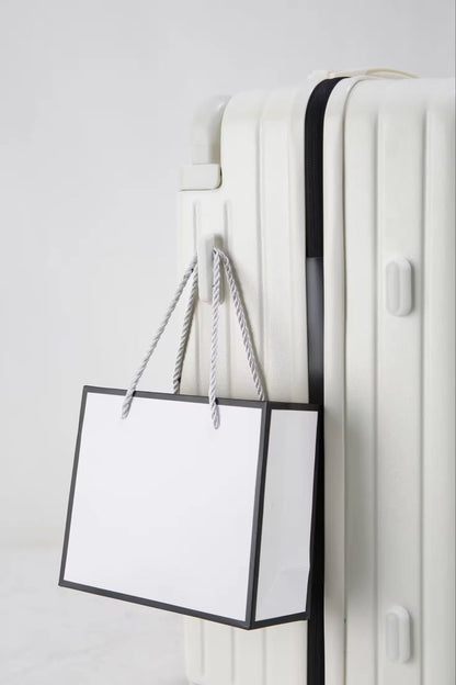White travel suitcase with side hook